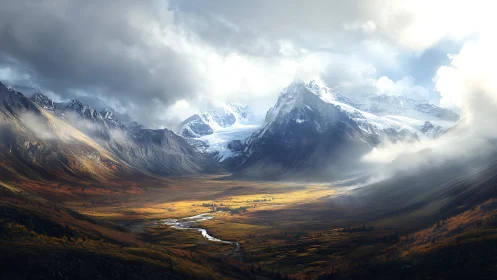 Sunlit valley cradled by storm-kissed snowbound peaks.