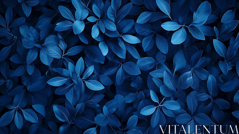 Monochrome blue foliage pattern with layered leaf textures.