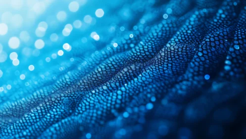 Abstract blue textured surface with glowing bokeh lights background.