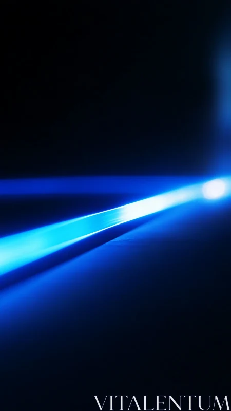 Electric blue light beam cutting through dark space.