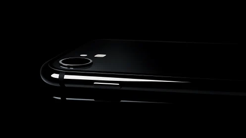 Sleek Midnight Device Gleams Against Darkness