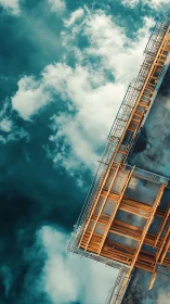 Skyward scaffolding reaches into clouds with bold calm energy