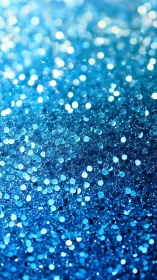 Out-of-focus macro view records dense blue glitter surface