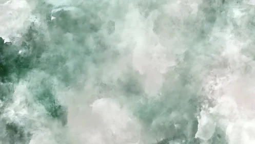 Soft misty green clouds drifting in a dreamy quiet sky.