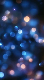 Defocused blue and amber light bokeh on dark background.