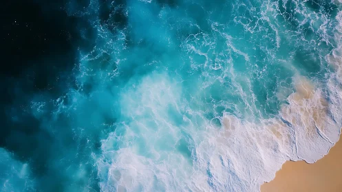 Gentle turquoise waves roll onto a soft sandy shoreline