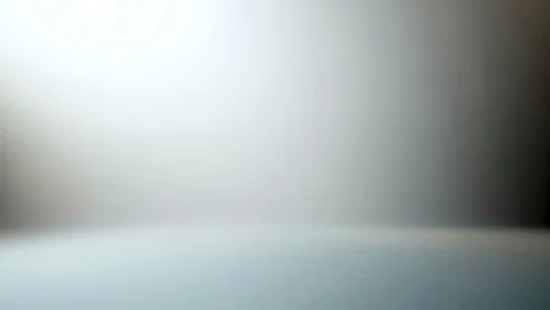 Soft horizon fade between silver fog and quiet light.