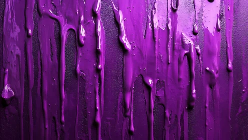 Vivid magenta paint drips cascading over dark canvas surface.