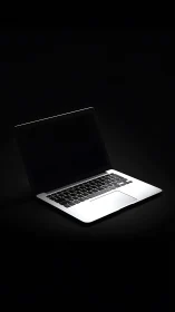 Midnight laptop leans into the dark like a quiet spotlight
