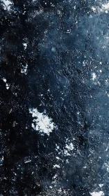 Dark textured abstract surface with white weathered specks.