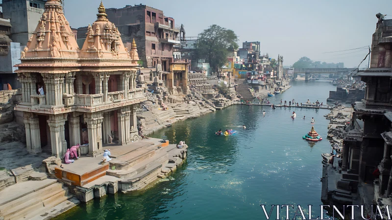 Riverfront temple ghats with bathers in hazy daylight scene.