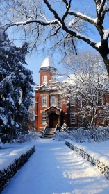 Brick institutional building in winter snow landscape.