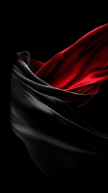 Velvet red and black satin waves in dramatic motion.