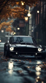 Moody black muscle car glides through a quiet autumn street