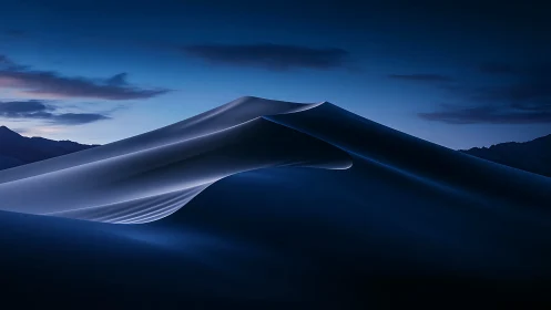 Nocturnal sand dunes curve under gradient blue twilight sky