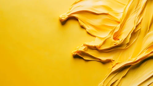 Yellow impasto strokes sculpt bold abstract texture field.