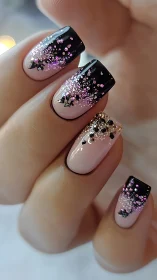 Black gradient glitter manicure showcases pink ombre nails