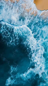 Aerial surf impact on sandy shoreline with turbulent foam detail