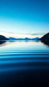 Glacial lake surface with concentric ripples at blue twilight