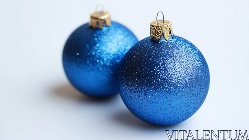 Twin sapphire baubles shimmer on winter-white silence.