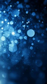 Glowing blue bokeh particles drifting through dark space.