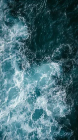Crashing turquoise waves churn in a powerful ocean close-up