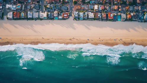 Aerial coastal housing grid aligned with wide sandy shoreline