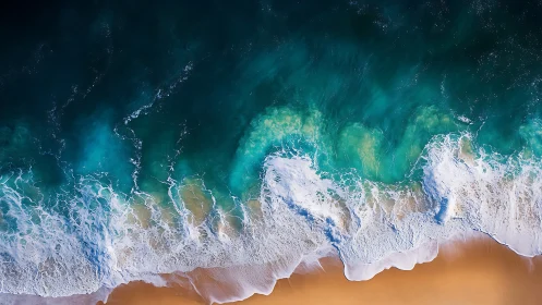 Aerial littoral interface with turbulent turquoise wave fields.