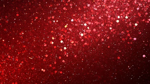 Red glitter particles form dense reflective textured surface