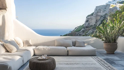 Outdoor lounge terrace overlooks rocky coast and sea