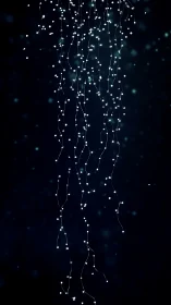 Parametric strands of luminescent particles in deep void space.