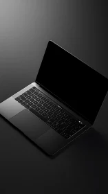 Open black laptop on dark gradient studio background.