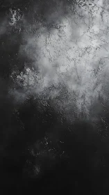 Velvety charcoal clouds swirling over a textured night sky.