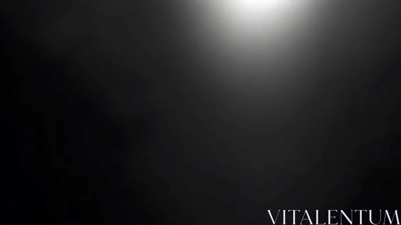 Lonely spotlight halo carving silence in charcoal dark.