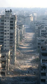 Destroyed urban street corridor shows severe structural damage