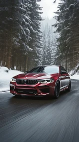 Crimson sports sedan glides confidently through snowy forest road