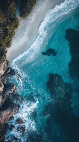 Aerial view captures turquoise surf along rugged rocky coast