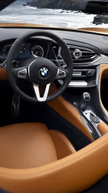BMW interior shows coastal drive with tan leather cockpit