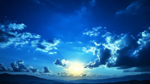 Gentle blue sunrise spilling light across quiet clouds.