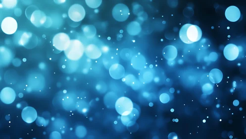 Blue bokeh abstract background with glowing light circles.