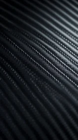 Carbon fiber style diagonal surface shows fine ridged texture