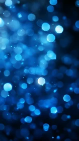 Blue bokeh light orbs on deep blurred background.