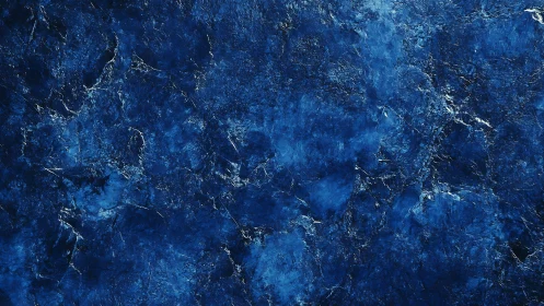 Textured cobalt abstract surface with fractured tonal depth.