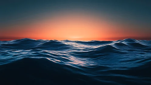 Ocean swells under vivid gradient sunset horizon line.