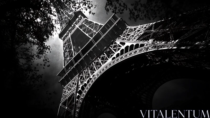 High-contrast structural study of illuminated iron lattice tower.