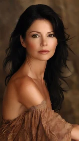 Brunette woman portrait under warm studio beauty lighting.
