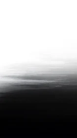 Monochrome gradient forms horizontal blurred divide of tones