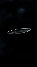 Silver disc drifting through quiet darkness of space.