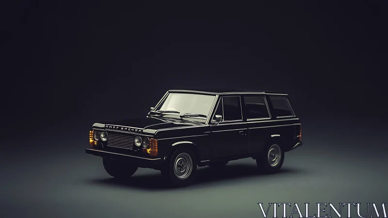 Vintage black station wagon model in dark studio lighting.