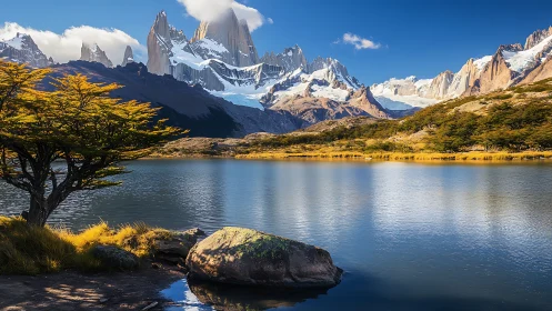 Peaceful mountain lake cradled by sunlit Patagonian peaks.